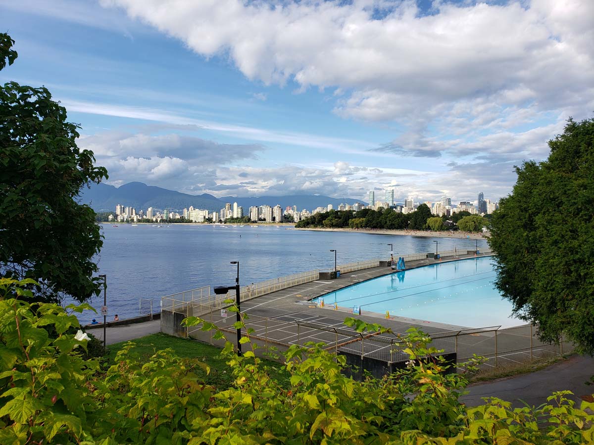 Kitsilano Beach and Pool with Vancouver skyline in the background.