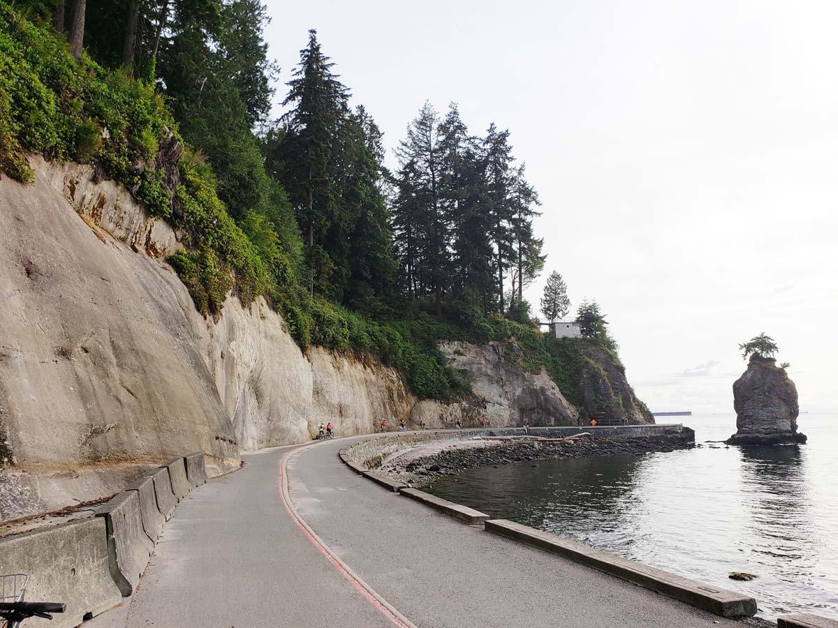 Siwash Rock along the Stanley Park Seawall with a scenic view.