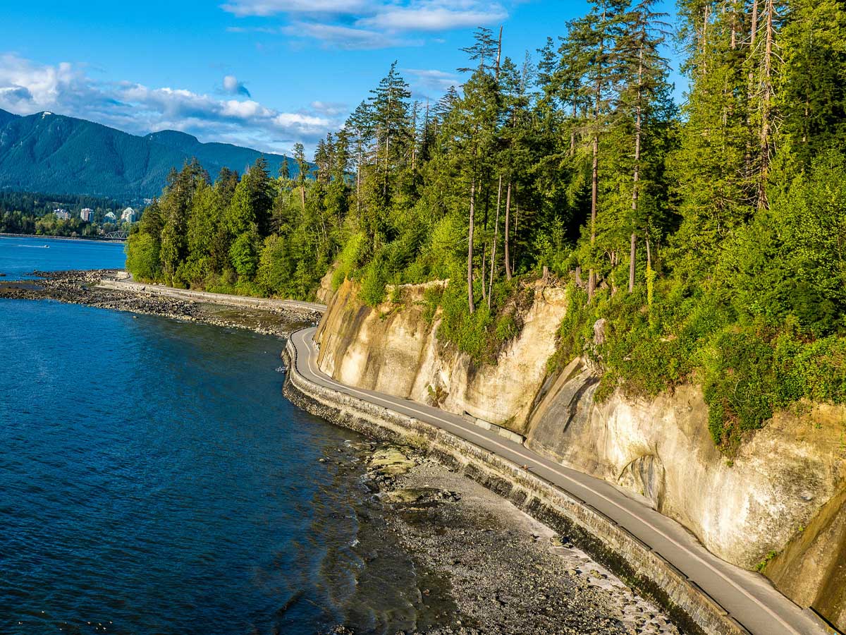 Stanley Park Seawall winding along the rocky coastline and forest.