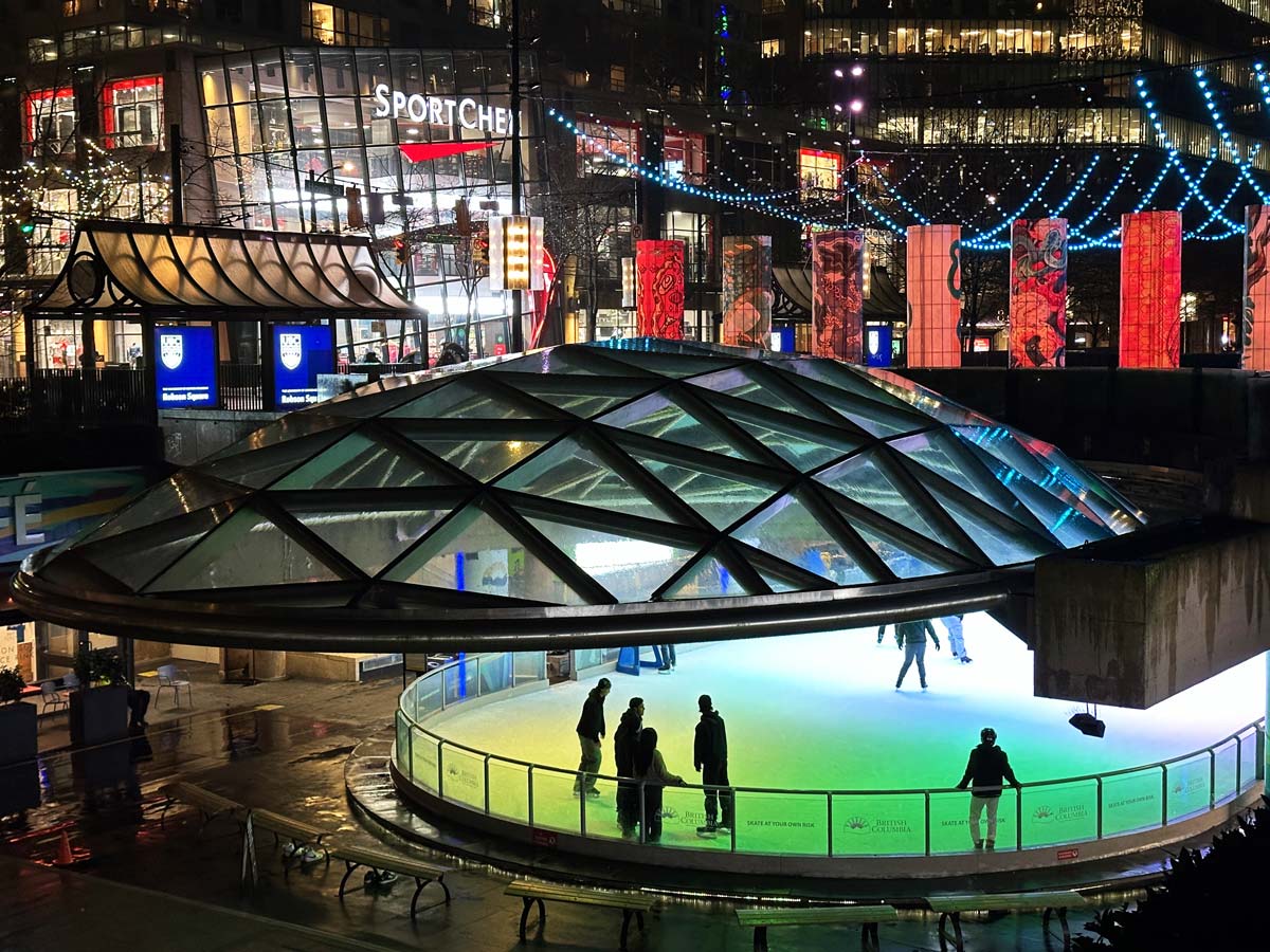 Night view of Robson Square’s lit-up outdoor skating rink.