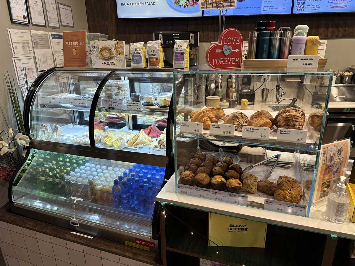 Pastries, sandwiches, and drinks displayed at Blenz counter.