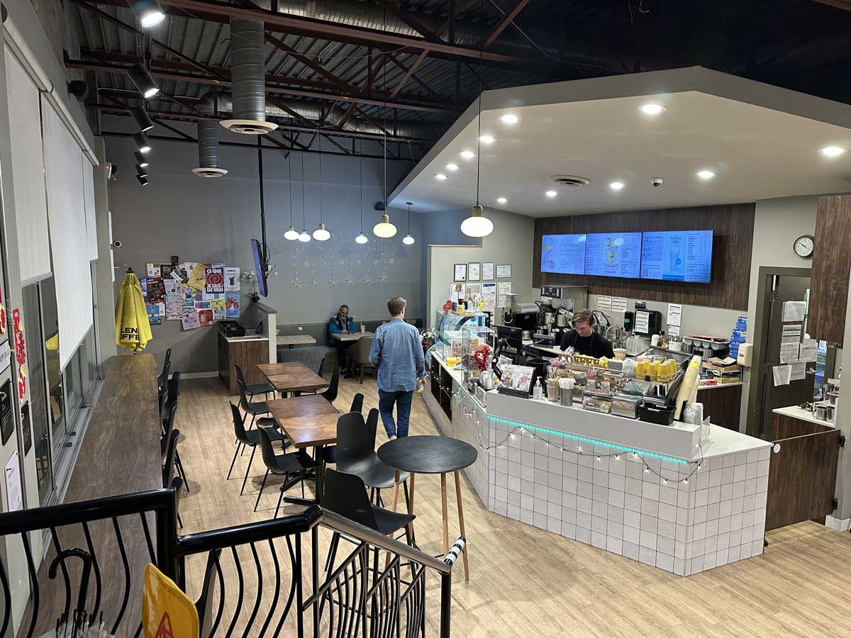 Interior view of Blenz Coffee with counter and seating area.