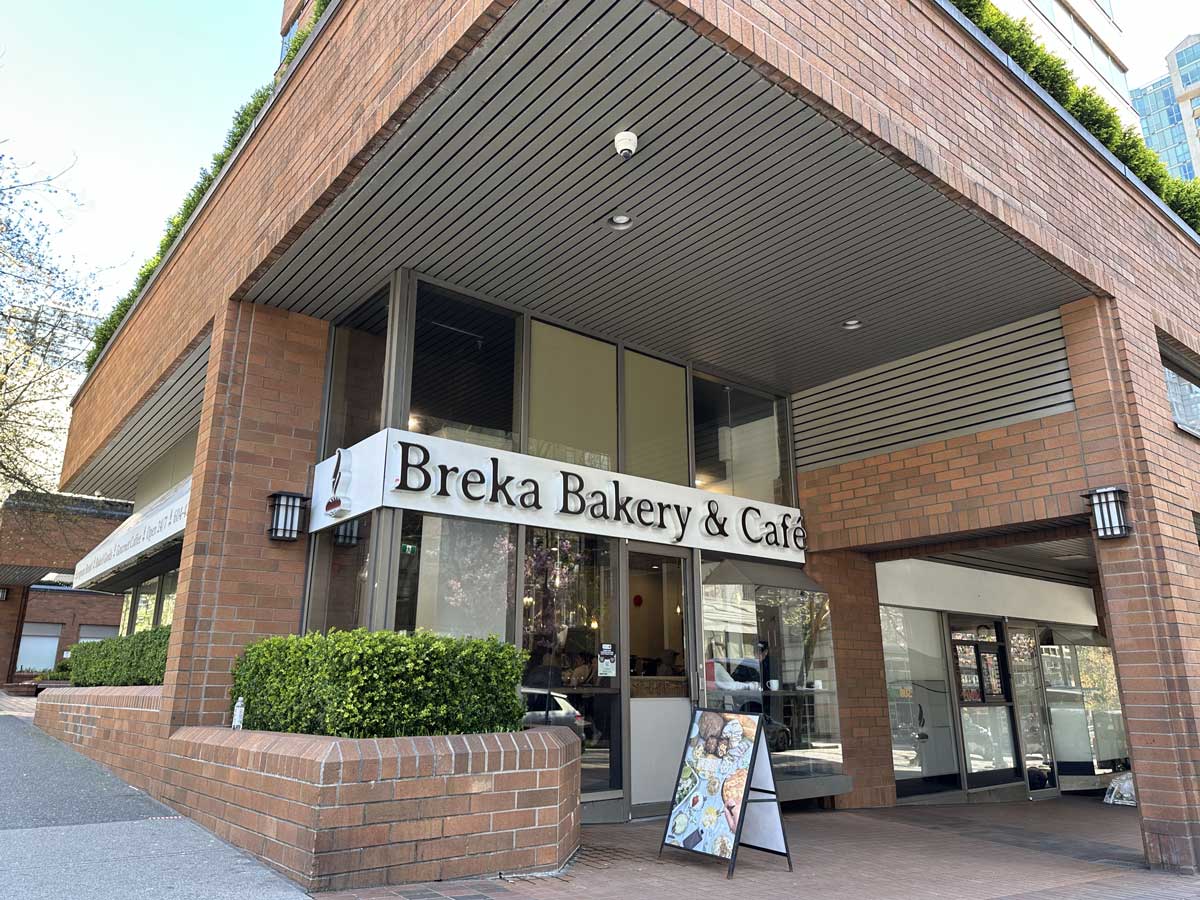 Entrance view of Breka Bakery & Café on a sunny day.