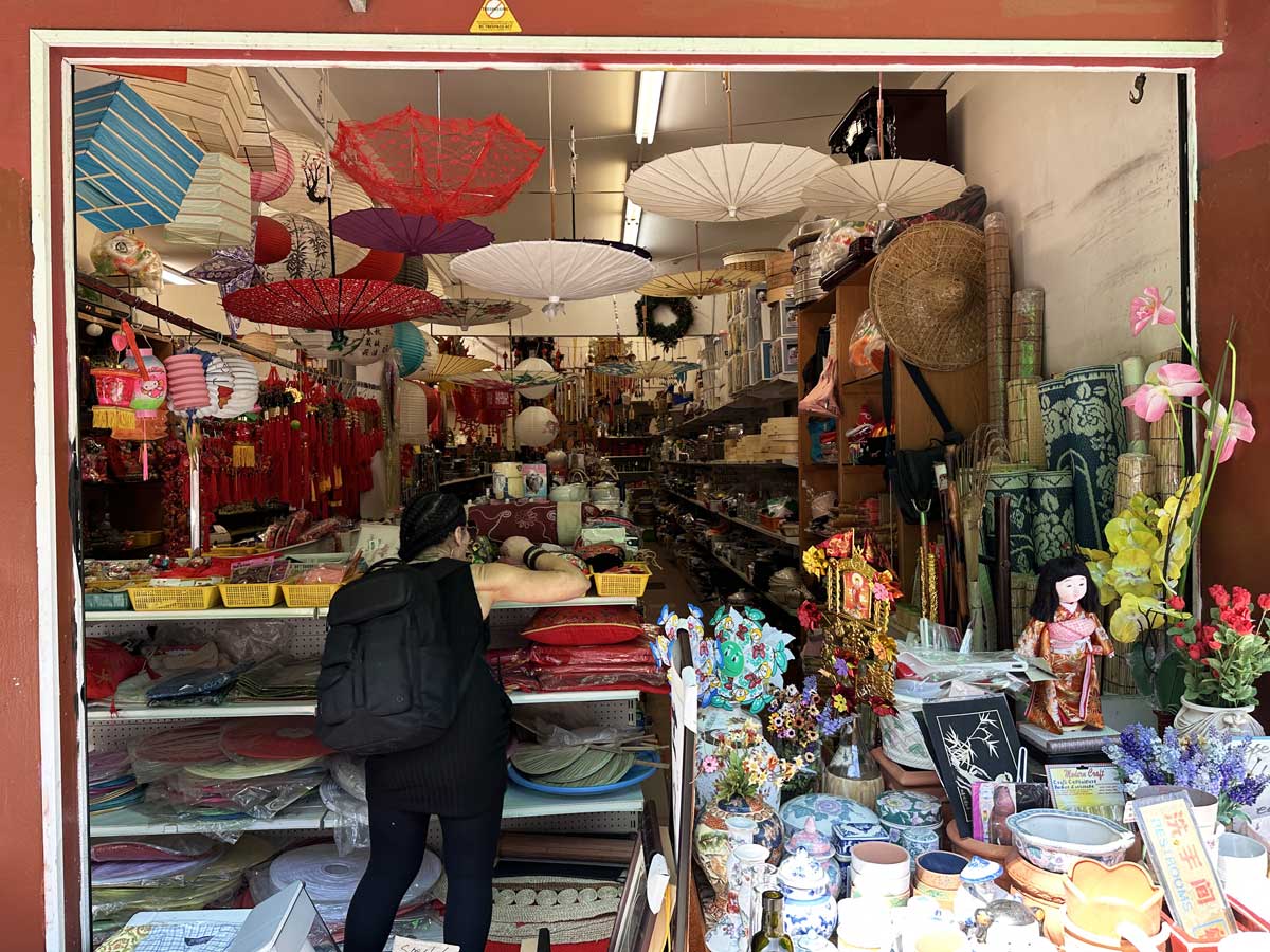 A Chinatown shop filled with paper umbrellas, decor, and souvenirs.