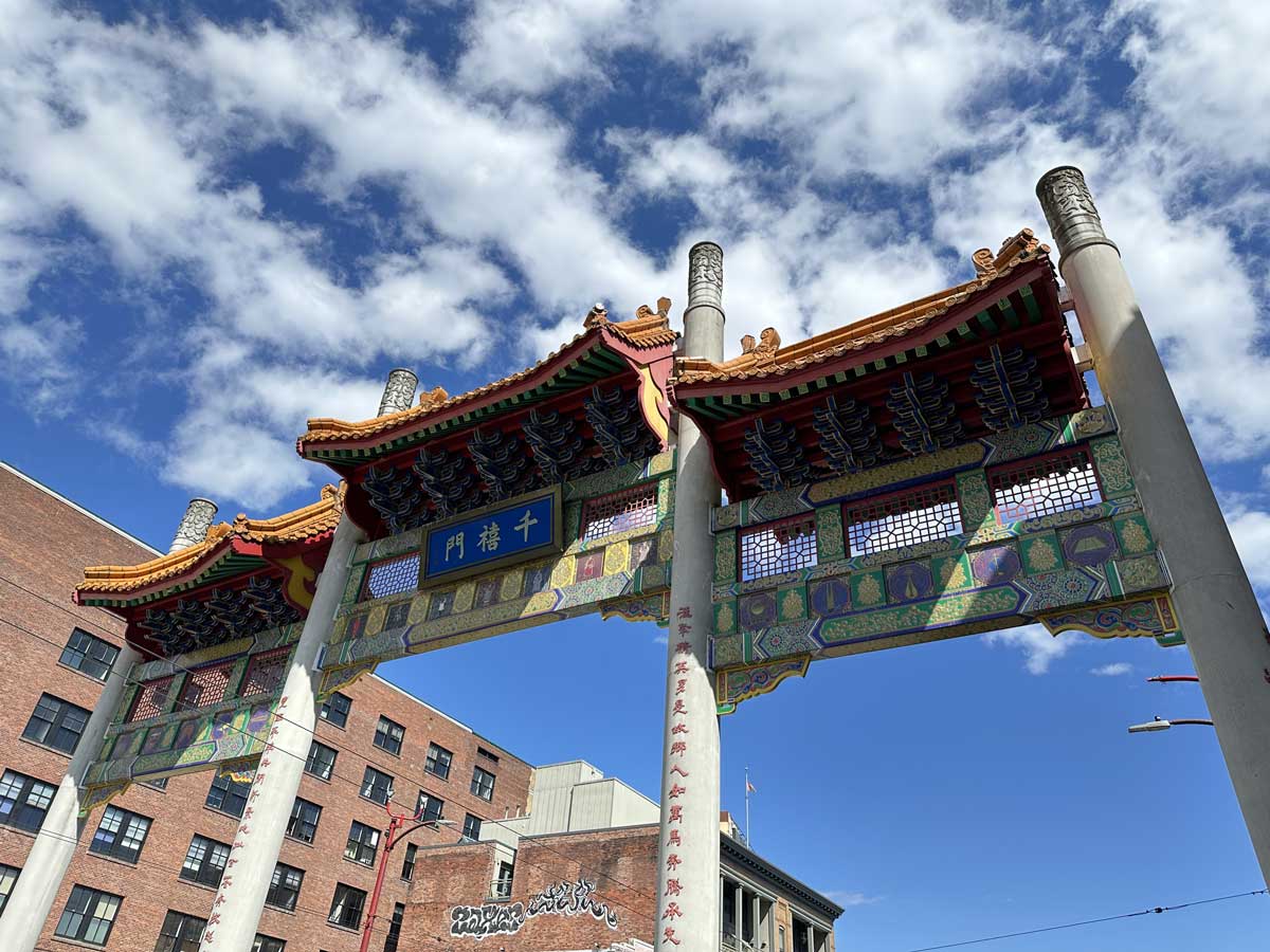 Close-up view of Vancouver Chinatown Millennium Gate under blue sky.