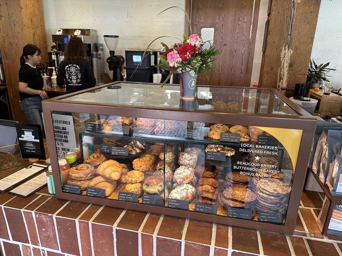 Pastry display case with fresh baked goods at Analog Coffee.