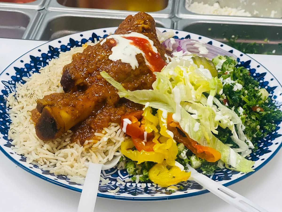 Lamb Shank with Rice and Fresh Salad at Donair Master.