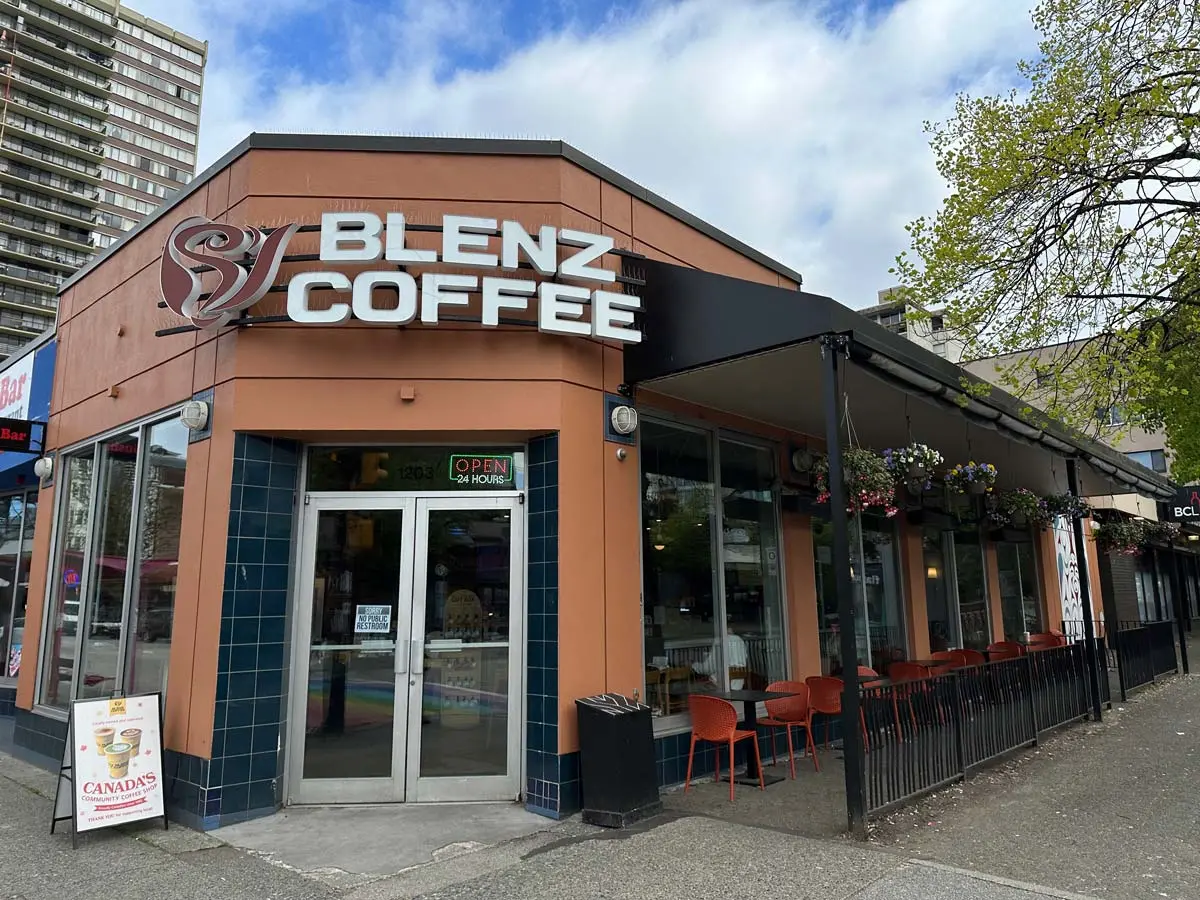 Blenz Coffee at Davie and Bute Street with outdoor seating and 24-hour service sign.