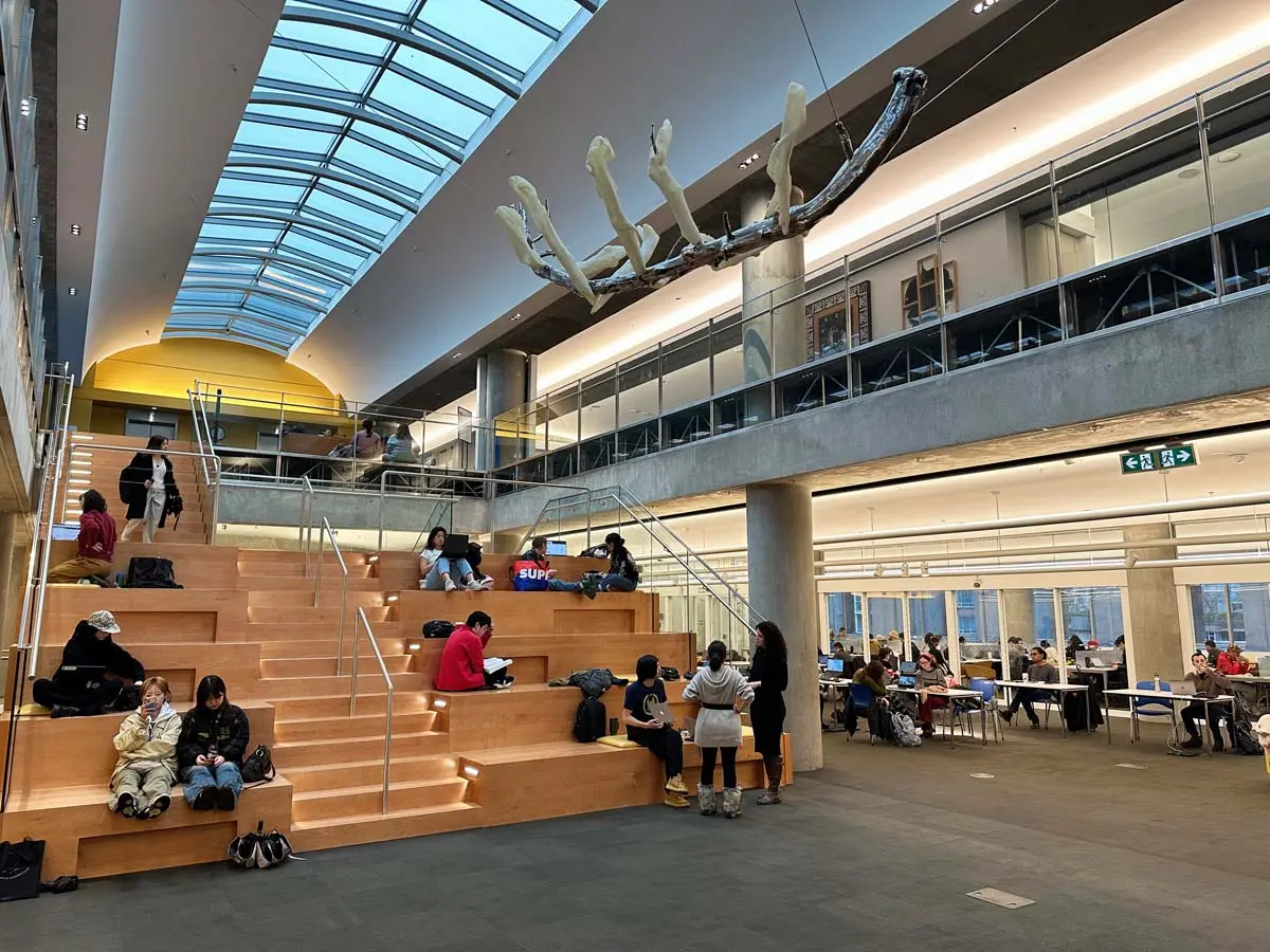 Vancouver Central Library's seating area with study desks and skylight.