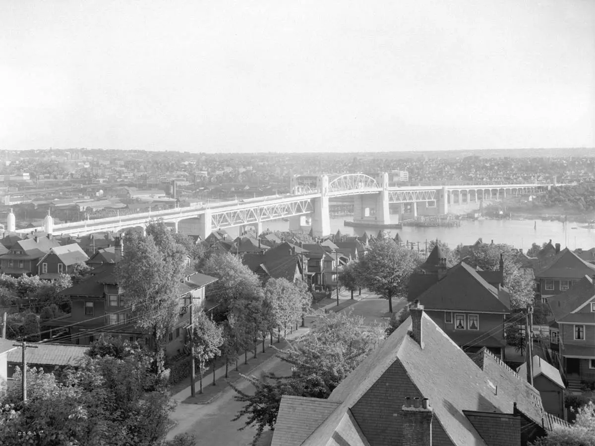 Historic view of Burrard Bridge with surrounding Vancouver neighborhood.