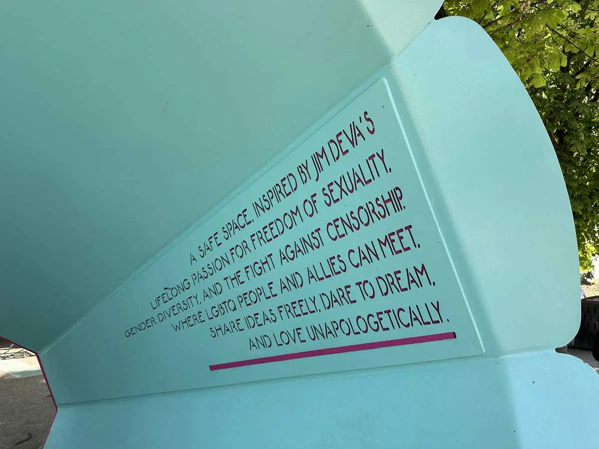 Text engraved on a teal wall at Jim Deva Plaza celebrating freedom, diversity, and LGBTQ+ community support.