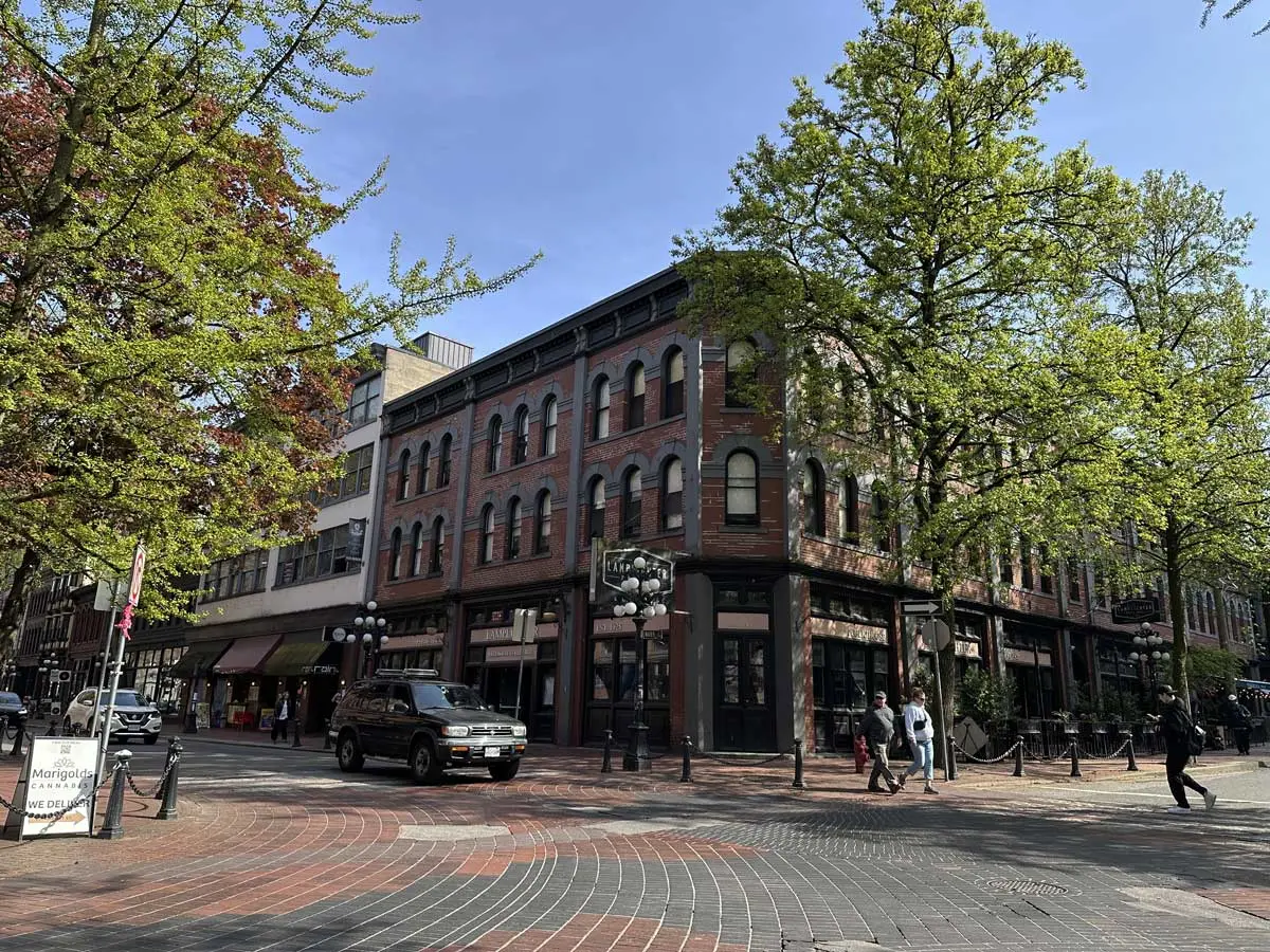 Corner view of Maple Tree Square with red-brick heritage buildings.