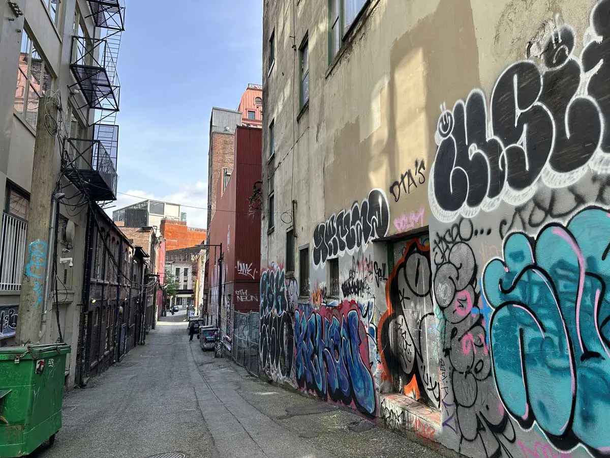 Graffiti art along a narrow back alley in Gastown, Vancouver.
