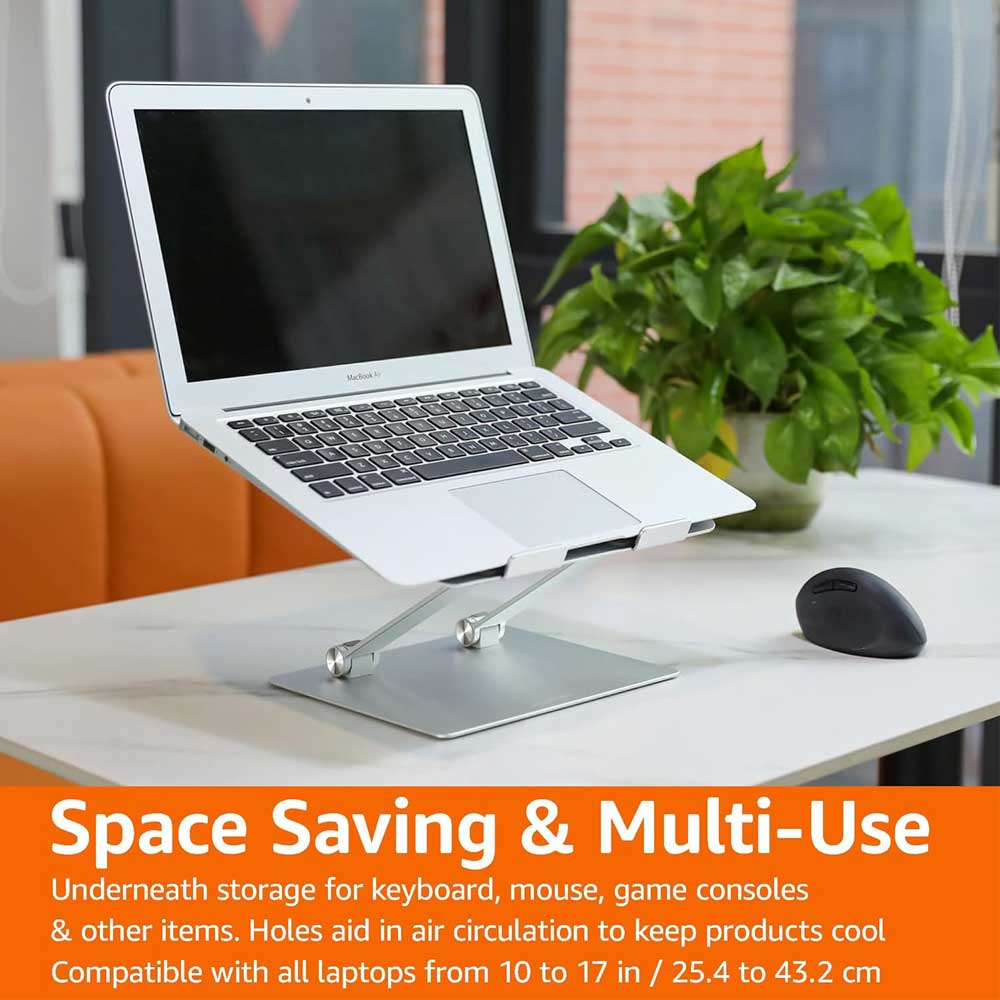 Laptop on adjustable silver stand with storage space below.